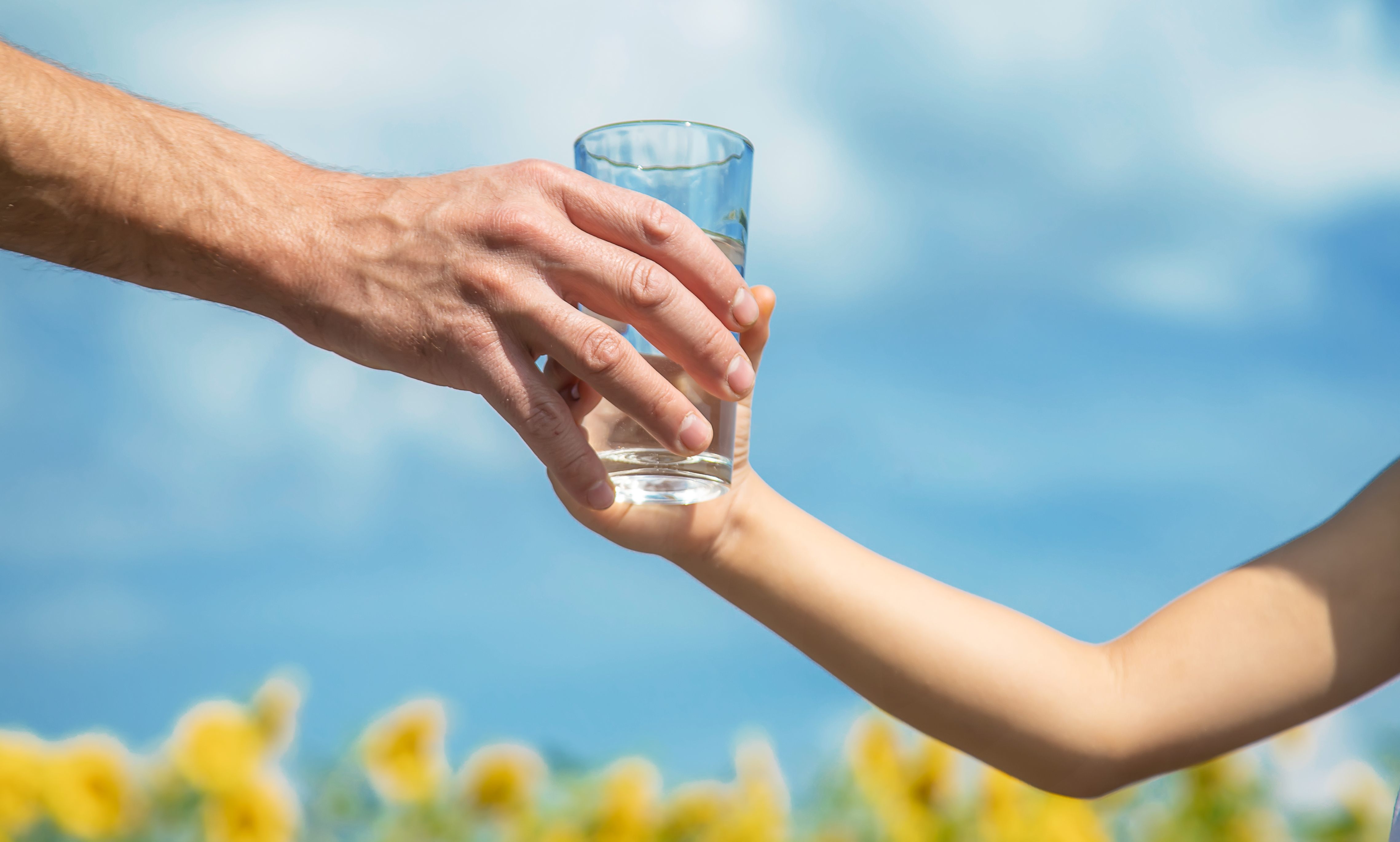 handing a glass of water