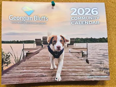 a 2026 print calendar featuring a puppy on a dock on the cover.